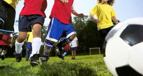 Children playing soccer.